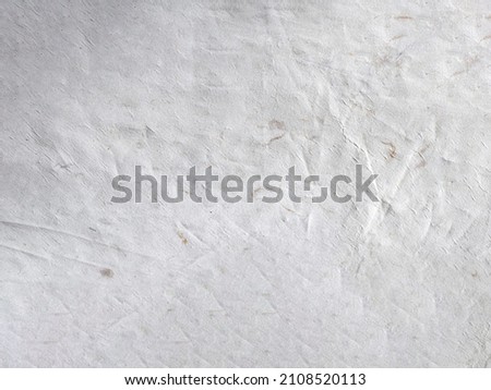 White grey old wall with shabby damaged Cement and brick background of an vintage dirty Textured background. peeling of colour. Crumpled fabric texture, cloth background. Natural linen background