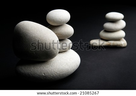 white stones against black background