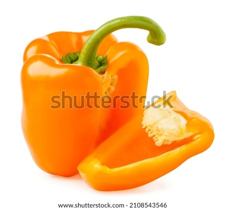 Orange pepper with a cut piece close-up on a white background. isolated