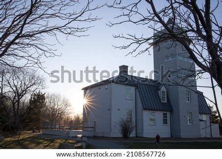 A scenic view of a lighthouse in Halibut Point State Park in Rockport, Massachusetts