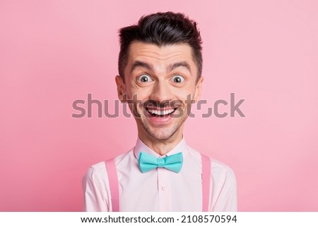 Portrait caricatured creative face design of excited crazy man isolated on pink colored background