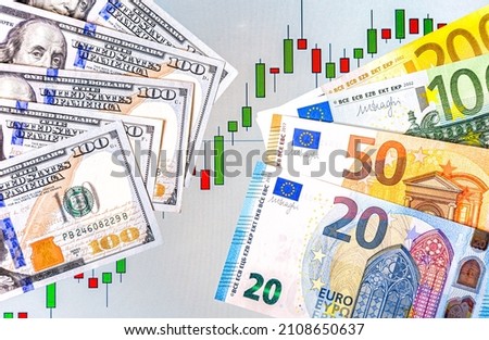 Graph rate chart against the background of American dollars and Euro  banknotes. Business concept