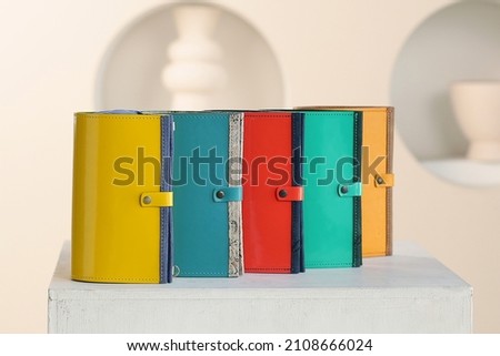 colored leather purse assortment close up photo in human hand
