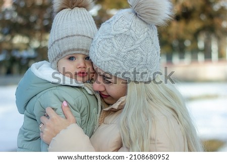 mother and baby boy in winter, parent and child in winter
