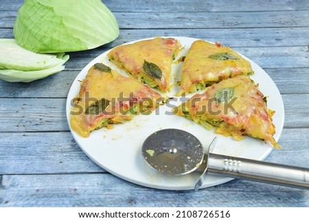 Homemade cabbage pizza with tomato sauce and cheese