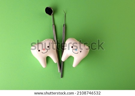 the medicine. model of teeth. dentistry.figures of teeth and dentist tools on the background