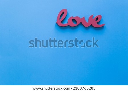 Red Love sign on the blue background
