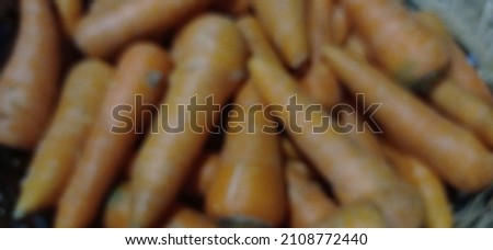 defocused and blurry photo of carrot vegetable
