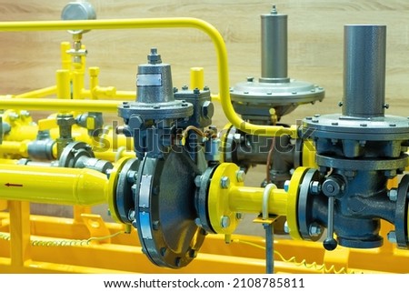 Gas control equipment. Natural gas supplies. Yellow pipeline. Regulators and pressure reducers on gas pipelines. Industrial equipment. Telemetry at the fuel company. Royalty-Free Stock Photo #2108785811
