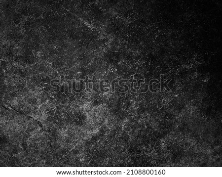 Dark cement wall background in vintage style for graphic design or wallpaper. The pattern of the concrete floor is aged in a retro concept.