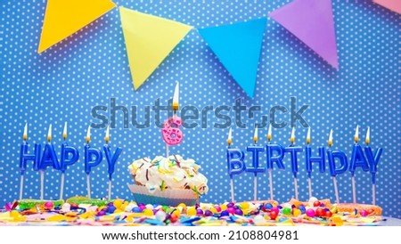 A word made from the letters of happy birthday candles for a six year old child. Copy space Happy birthday greetings for 6 year old, lit candles with holiday decorations. Beautiful holiday card