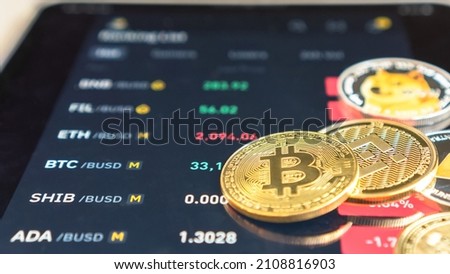 Cryptocurrency on Binance trading app, Bitcoin BTC with BNB, Ethereum, Dogecoin, Cardano, Litcoin, altcoin digital coin crypto currency defi p2p decentralized finance and fintech banking market Royalty-Free Stock Photo #2108816903