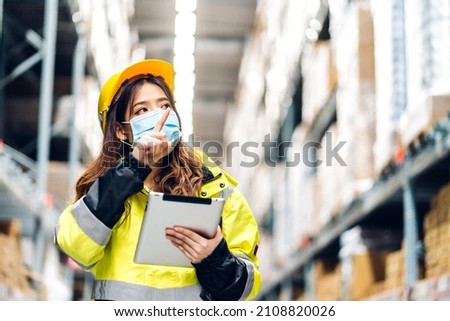 Portrait asian engineer woman shipping order detail on tablet check goods and supplies on shelves with goods background inventory in factory warehouse.logistic industry and business export