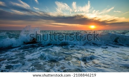 High Resolution 16:9 Image Ratio Ocean Landscape With A Detailed Foreground Of A Wave Breaking Towards Shore