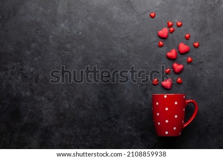 Coffee cup and heart shaped candy. Top view flat lay with copy space. Valentines day greeting card template Royalty-Free Stock Photo #2108859938