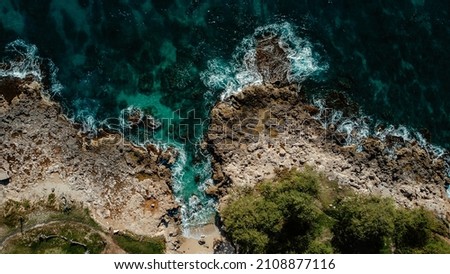 Aerial view of rocky shore on tropical island
