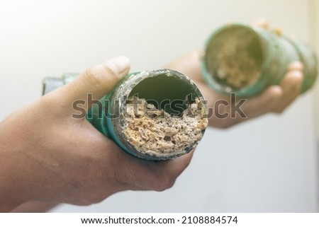 Embolism: A pipe clogged or sewer with thick fats, oil and grease Royalty-Free Stock Photo #2108884574