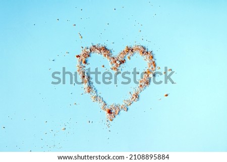 breadcrumbs heart symbol on blue background