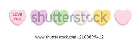Sweet heart shaped candy. Conversation sweets for Valentine's Day isolated on white background with copyspace for your text. Sweetheart candies with love you message.