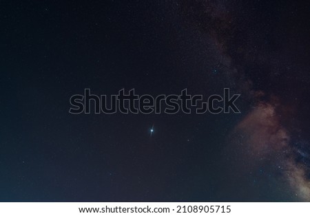 night sky milky way and star on dark background. Vulpecula is a faint constellation in the northern sky. Its name is Latin for little fox.The Dumbbell Nebula is a planetary nebula in the constellation Royalty-Free Stock Photo #2108905715