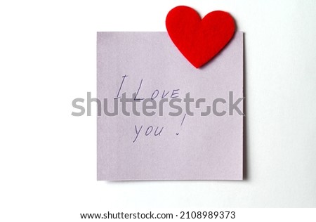 A close up of a sticky note with the word I Love You with red heart. Valentine's Day. Valentine's Day background. I love you lettering text. love concept. Royalty-Free Stock Photo #2108989373