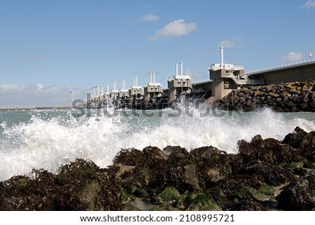 The Oosterscheldekering is a flood defense in the Netherlands, part of the Delta Works Royalty-Free Stock Photo #2108995721