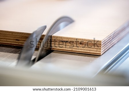 close up of a table saw in a carpenter's shop or workshop, professional circular saw of a craftsman Royalty-Free Stock Photo #2109001613