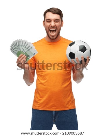 sport, leisure games and online betting concept - happy smiling man or football fan with soccer ball and money over white background Royalty-Free Stock Photo #2109003587