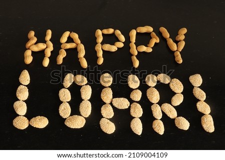 View of  Happy Lohri  written on black background with festive food items