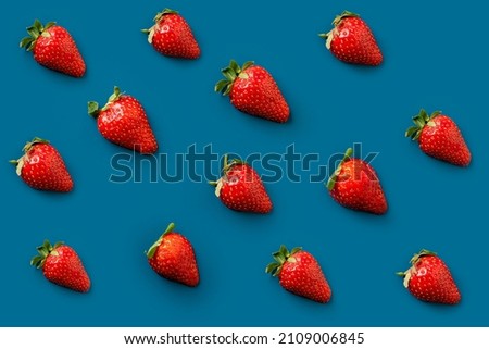 Flat lay strawberries. Different ripe strawberries isolated on blue background