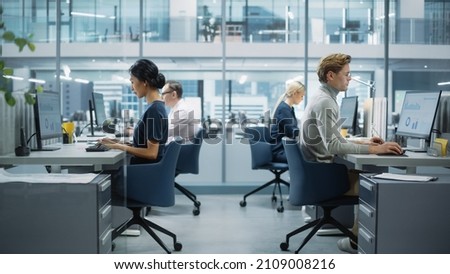Diverse Team of Finance Managers Working with Statistical Data in Modern Big City Office. Colleagues Work on New Business Opportunities, Evaluate Financial Reports, Plan Investment Strategy. Royalty-Free Stock Photo #2109008216