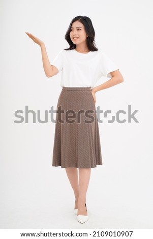 Asian attractive beautiful young woman with hand gesture, showing with finger on the copy space, isolated on background