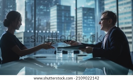 Multiethnic Diverse Office Conference Room Meeting: Two Creative Entrepreneurs Talk, Sign Contract. Stylish Young Businesspeople Work on Digital e-Commerce Startup Project.