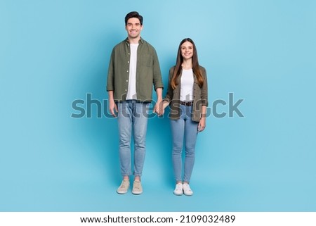 Full size photo of charming lady guy hold hands free time gathering honeymoon isolated over sky light color background