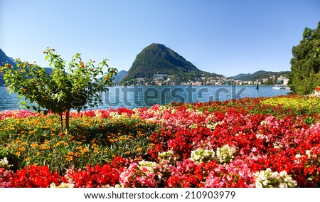 Lugano, Switzerland - Juli 31, 2014: Images of the Gulf of Lugano from Monte Bre above the City. Royalty-Free Stock Photo #210903979