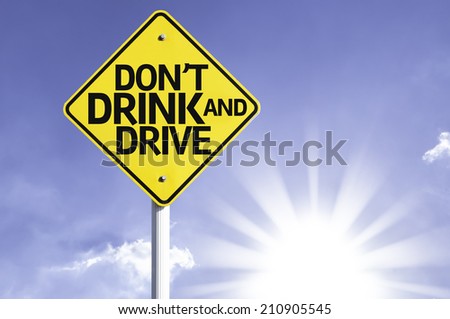 Don't Drink and Drive road sign with sun background 