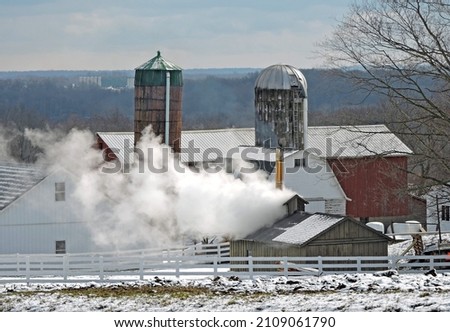 Amish sugarhouses in March in northeast ohio. Making maple syrup. Royalty-Free Stock Photo #2109061790