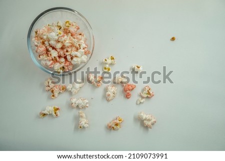 Close up of pop corn on the bowl with negative space.  That photos is perfect for food pamphlet, product poster, product promotion and ads.