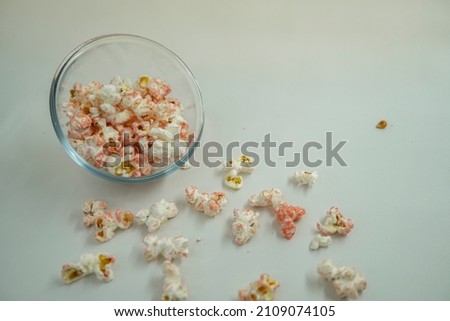 Close up of pop corn on the bowl with negative space.  That photos is perfect for food pamphlet, product poster, product promotion and ads.