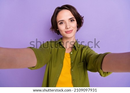 Photo of young adorable girl good mood take selfie vacation influencer isolated over violet color background