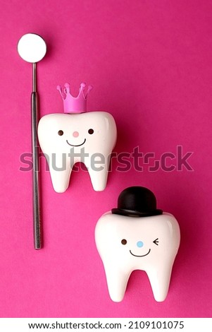 
the medicine. figurines of teeth and a heart on a blue background. dentistry. Valentine's Day.