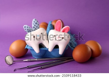 Happy easter.Stomatology concept.eggs, dentist tools and teeth figurines