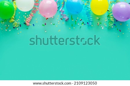 Birthday party decoration with balloons, steamers and confetti