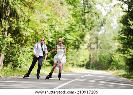 the groom and the bride skate on roller-skaters