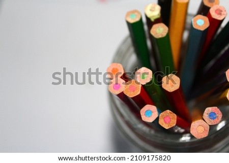 photo of a bunch of colored pencils on a white background suitable for powerpoint background