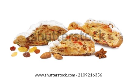 Traditional Christmas Stollen with icing sugar on white background