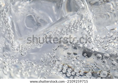Soda water with ice as background, closeup Royalty-Free Stock Photo #2109259715