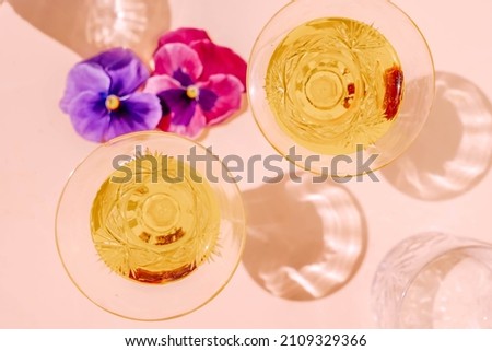 Champagne and pansy flowers styled stock scene in warm beige earth tones