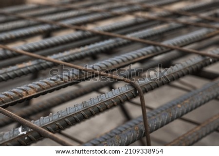 Metal rusty reinforcement bars. Reinforcing steel bars for building armature Royalty-Free Stock Photo #2109338954