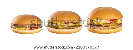 Set of 3 burgers on a white background. Hamburger, cheeseburger, double cheeseburger.  Royalty-Free Stock Photo #2109370577